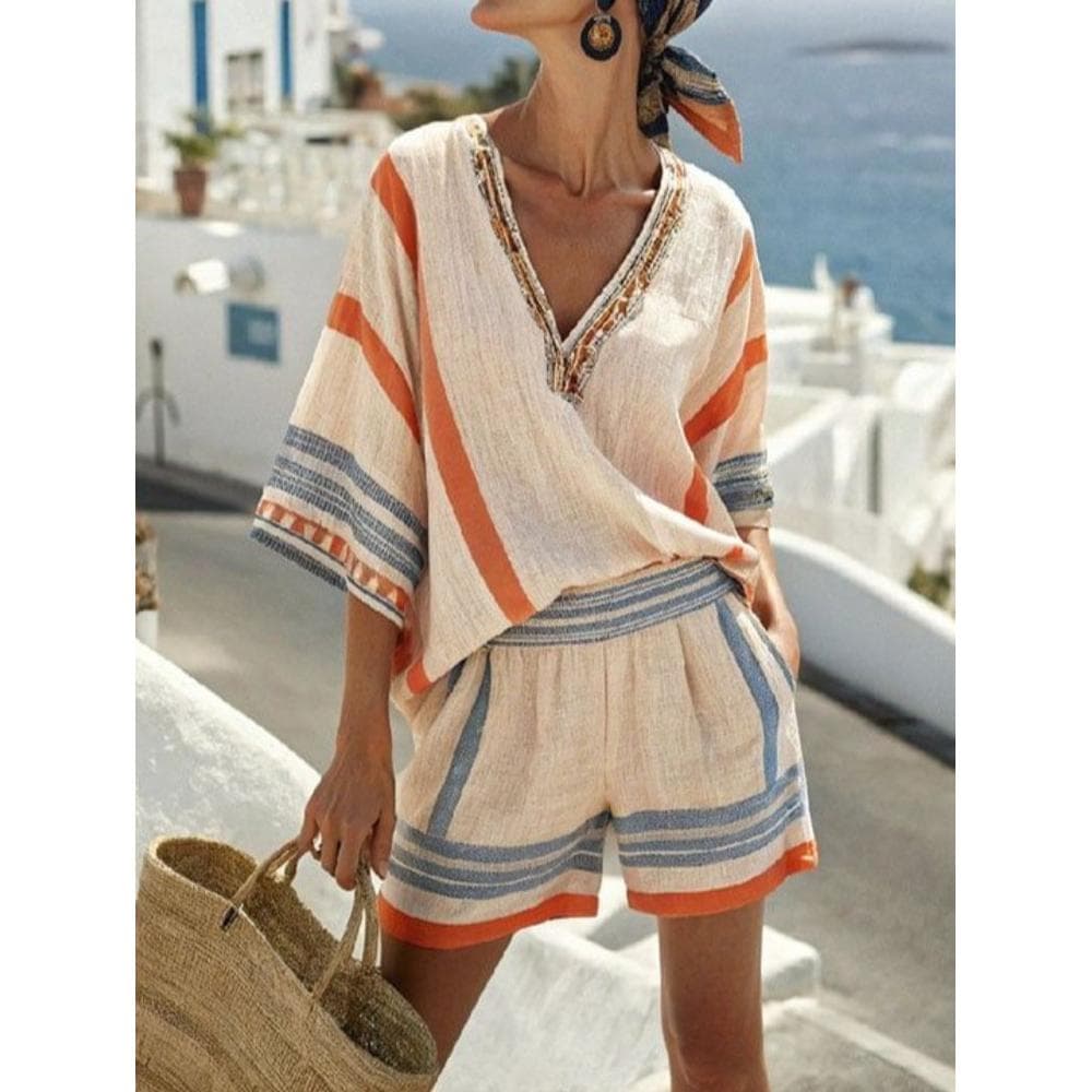 Ladies' Two-Piece Outfit Featuring an Orange And Blue Striped Design, with a Loose-Fitting V-Neck Top And High-Waisted Shorts, Perfect for Vacations And Casual Outings